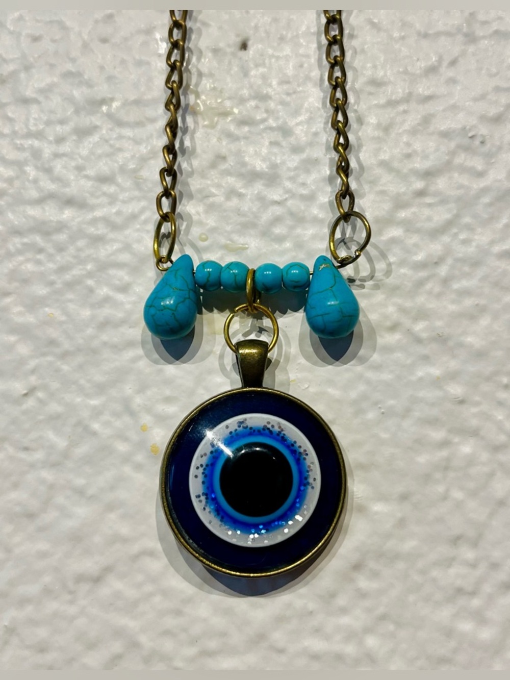 Turquoise and Gold Tone Evil Eye Pendant Necklace